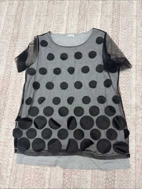 Brunello Cucinelli T-shirt is crafted from sheer mesh fabric featuring blac